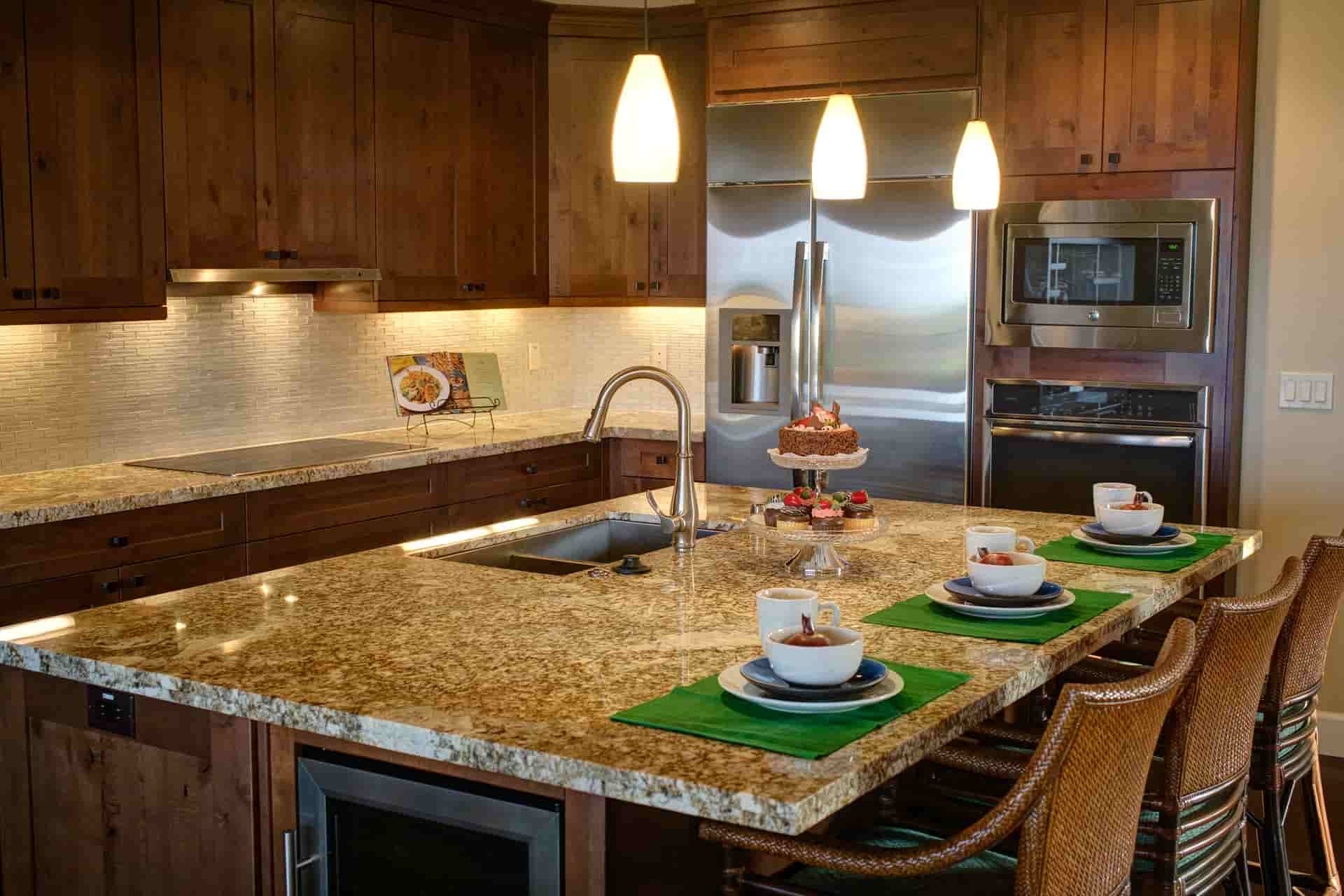 Modern kitchen with new refrigerator and cooker