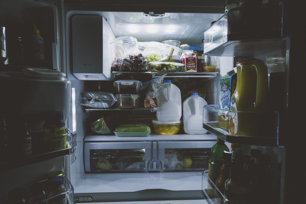 Open refrigerator full of food