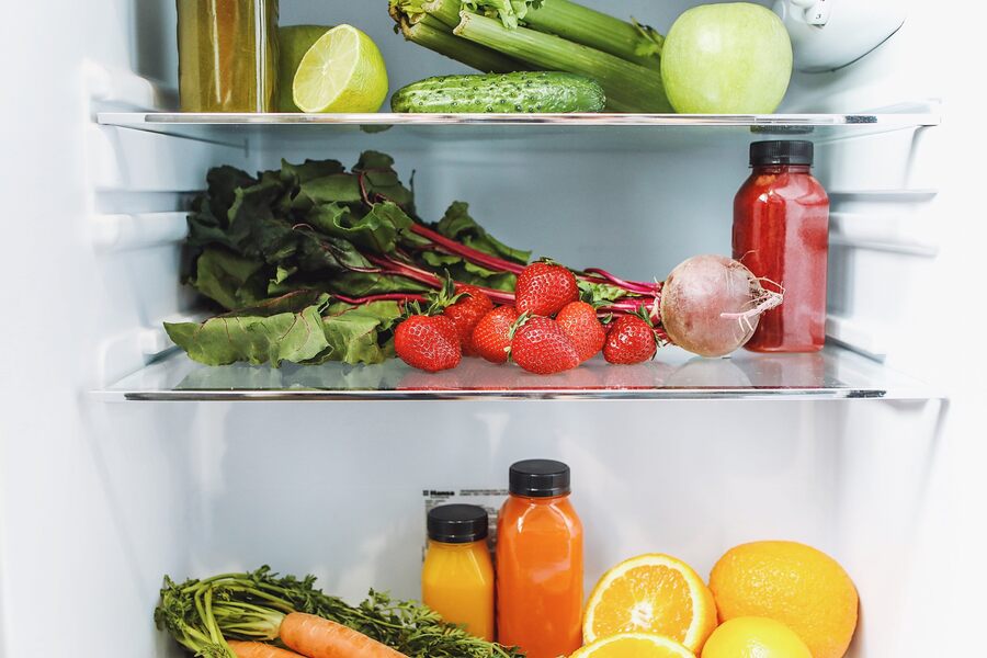 clean fridge full with vegetables