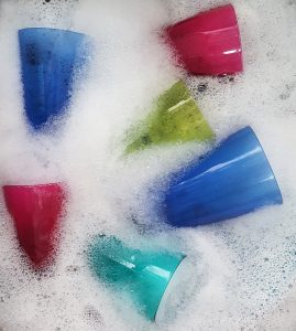 glasses in soapy water
